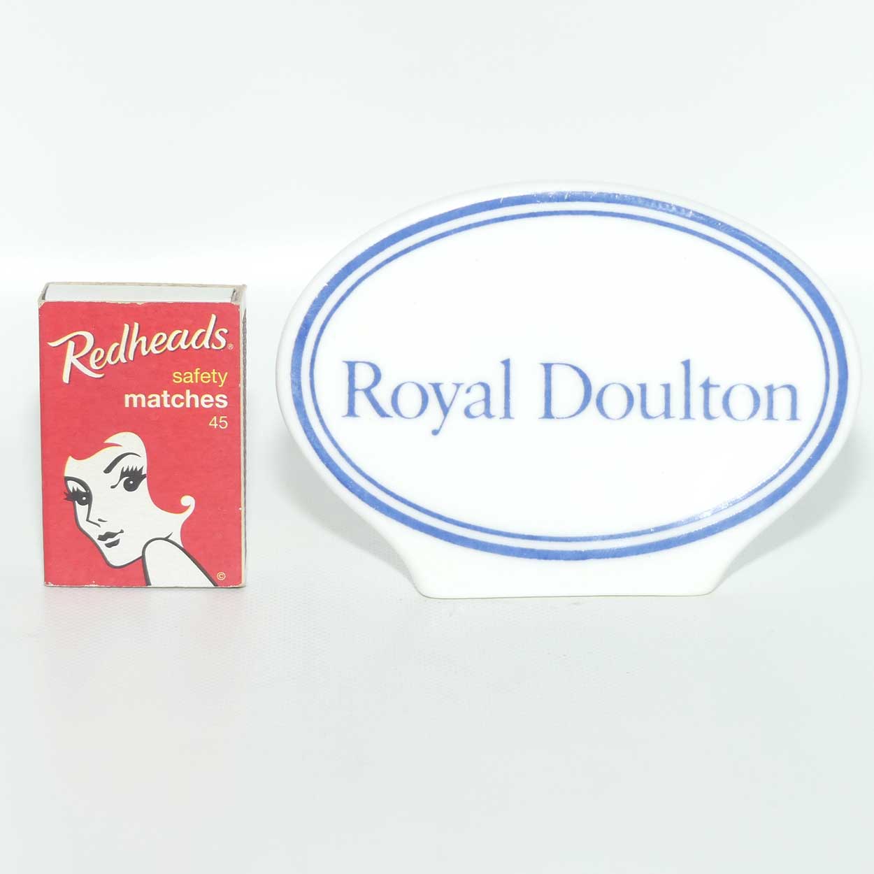A Royal Doulton figurine oval display plaque
