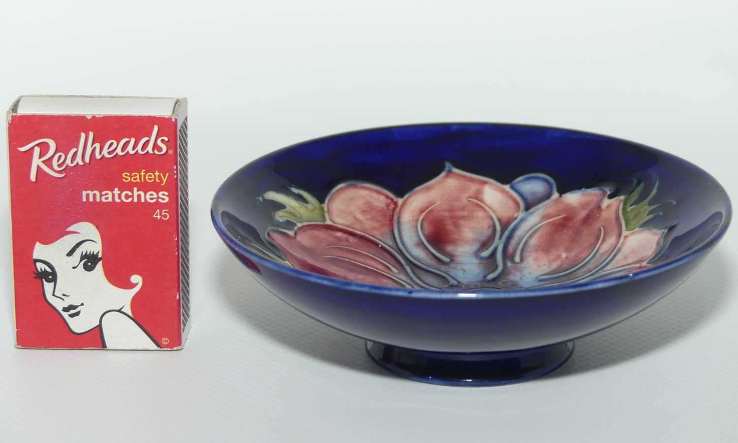 Walter Moorcroft Anemone with Blue ground footed bowl | 11cm diam