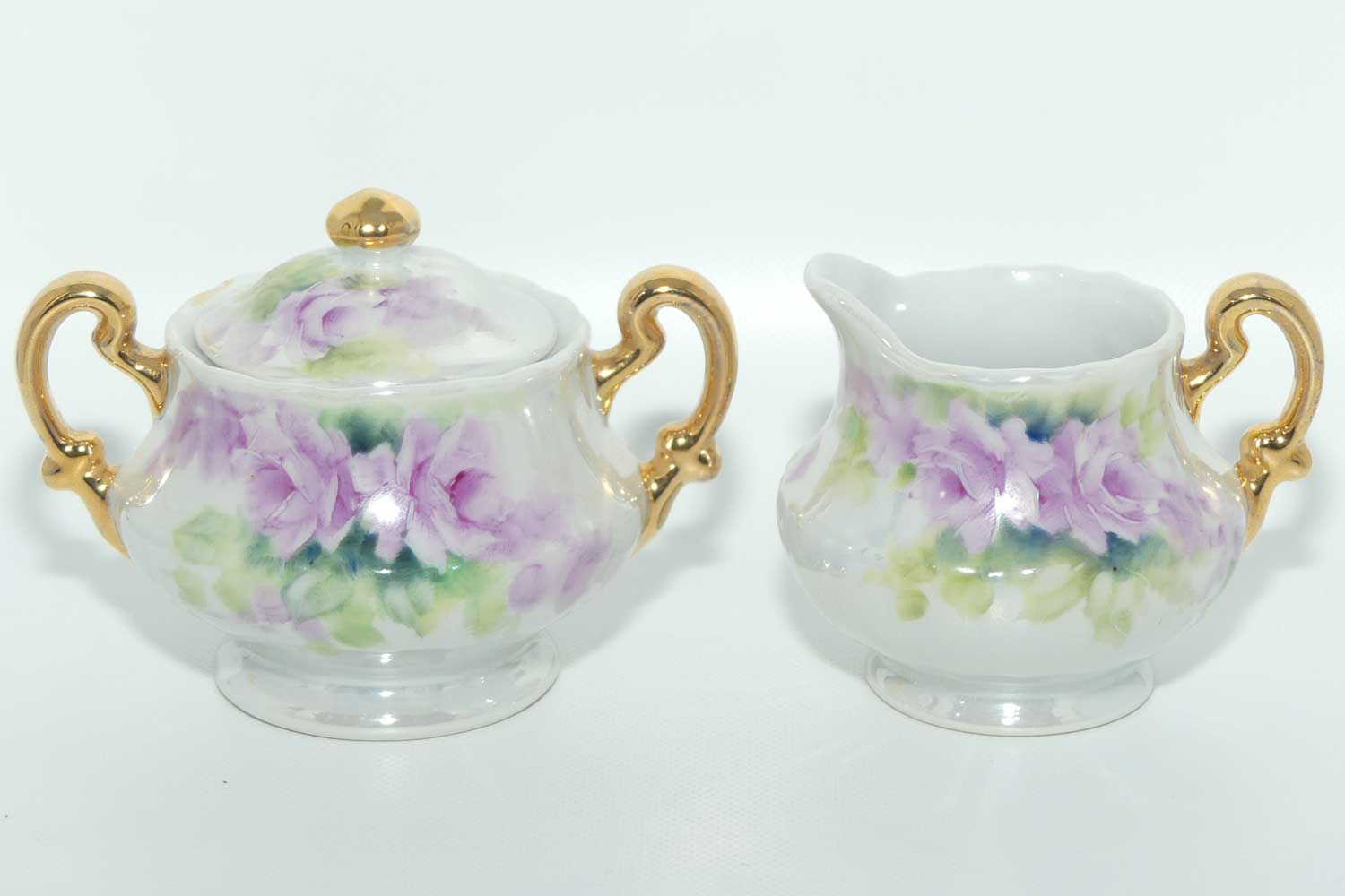 Australian China Painting milk and sugar decorated with Mauve flowers | by Paula Atack 1986