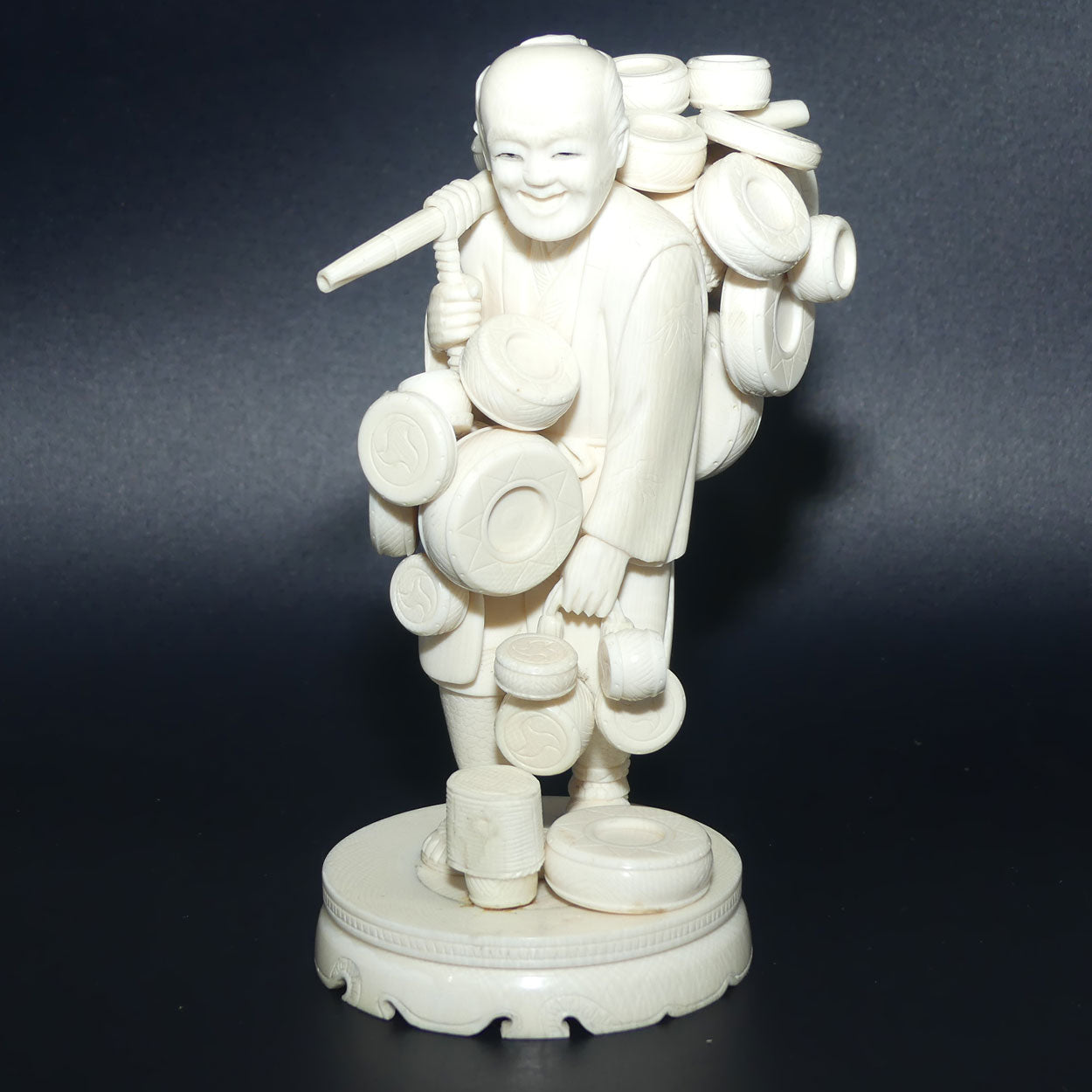 Japanese Carved Ivory Okimono figure on wooden base | Basket Vendor | Meiji period | signed