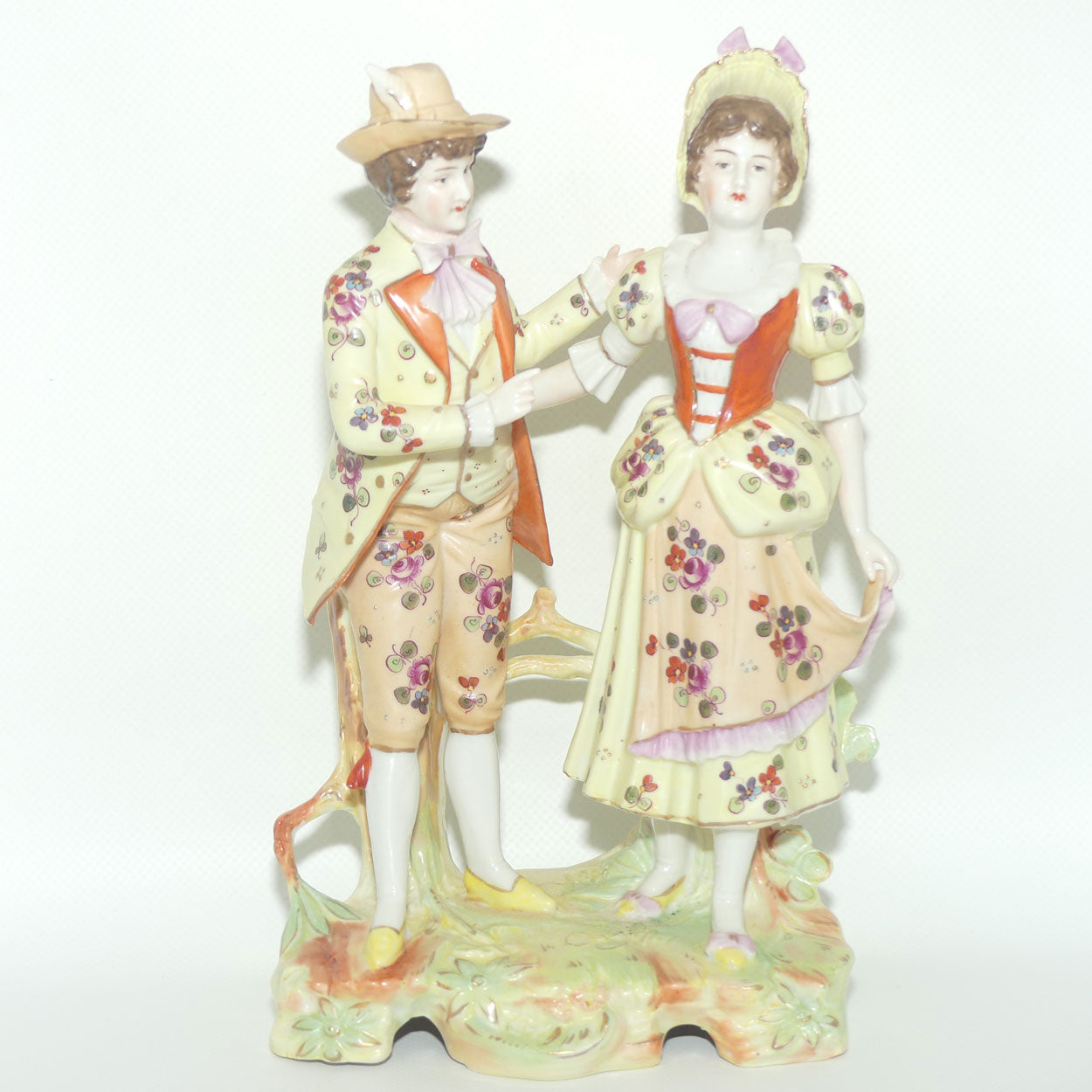 Victorian era Lady and Gent bisque figurine group