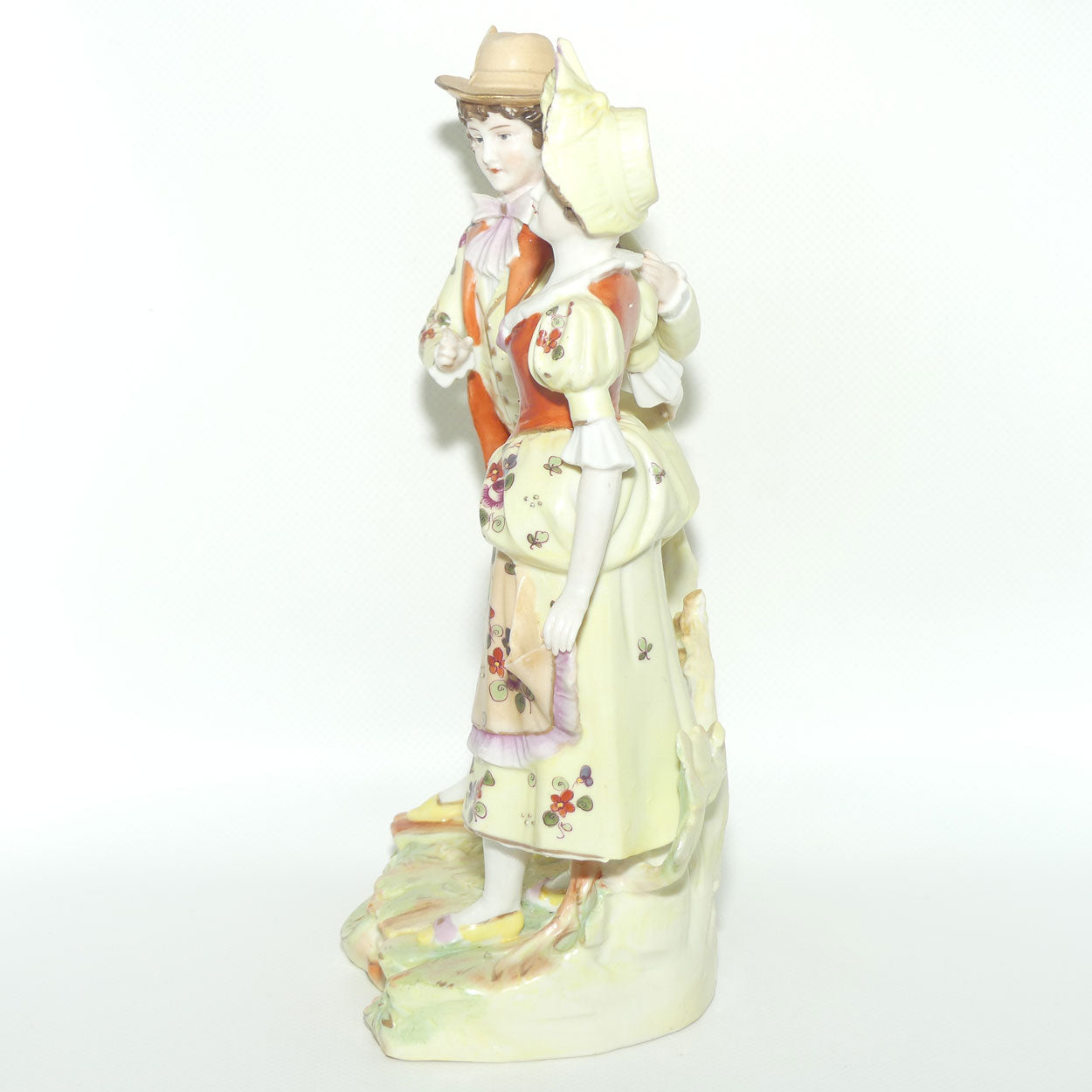 Victorian era Lady and Gent bisque figurine group