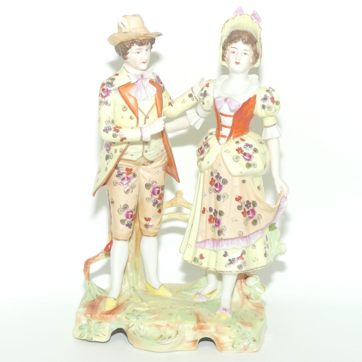 Victorian era Lady and Gent bisque figurine group