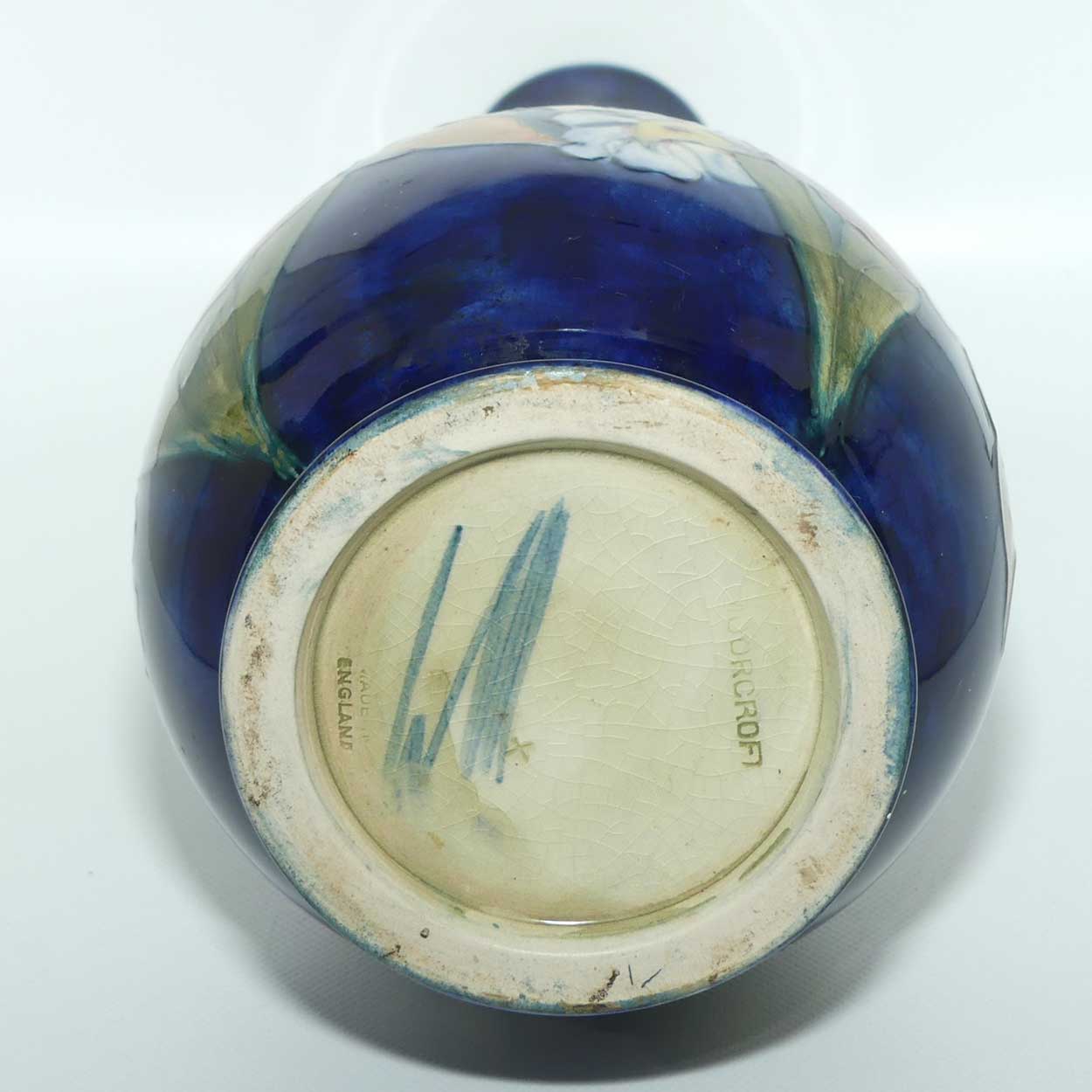 Walter Moorcroft Orchid on Dark Blue Ground tall narrow neck bottle vase