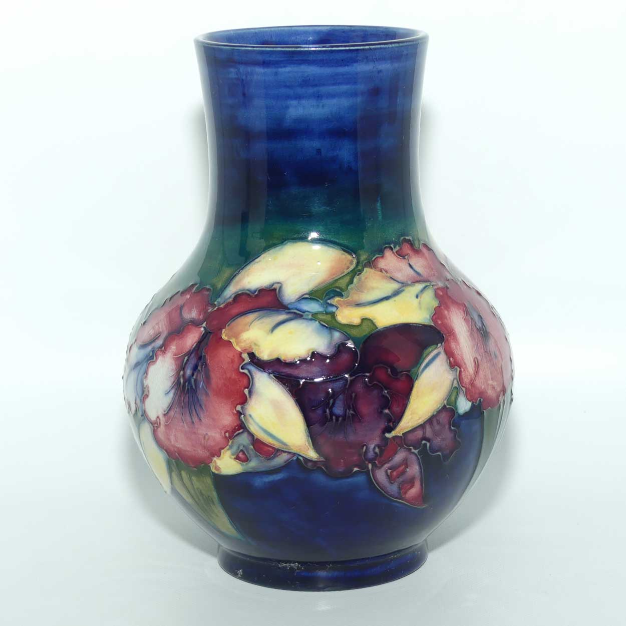 Walter Moorcroft Orchid on Dark Blue Ground bulbous vase