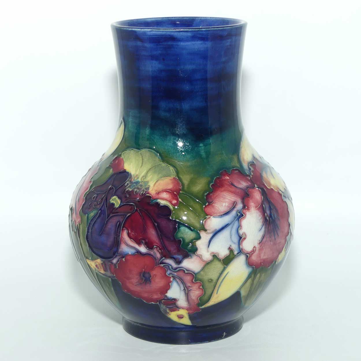 Walter Moorcroft Orchid on Dark Blue Ground bulbous vase