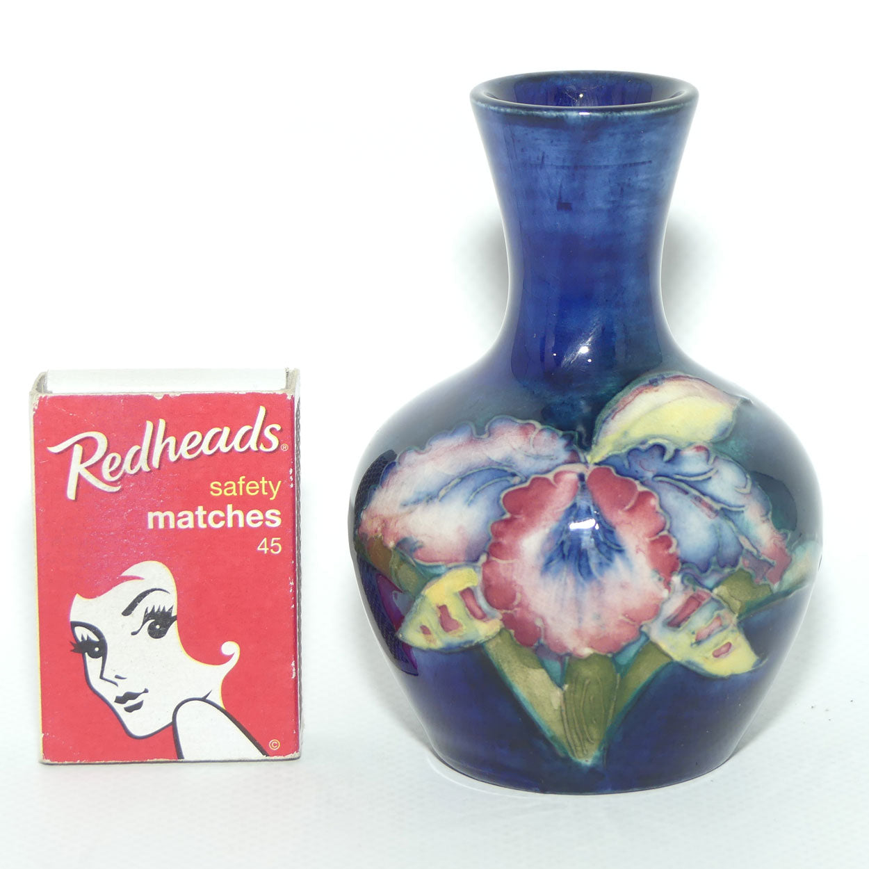 Walter Moorcroft Orchid on Blue Ground narrow neck miniature bud vase