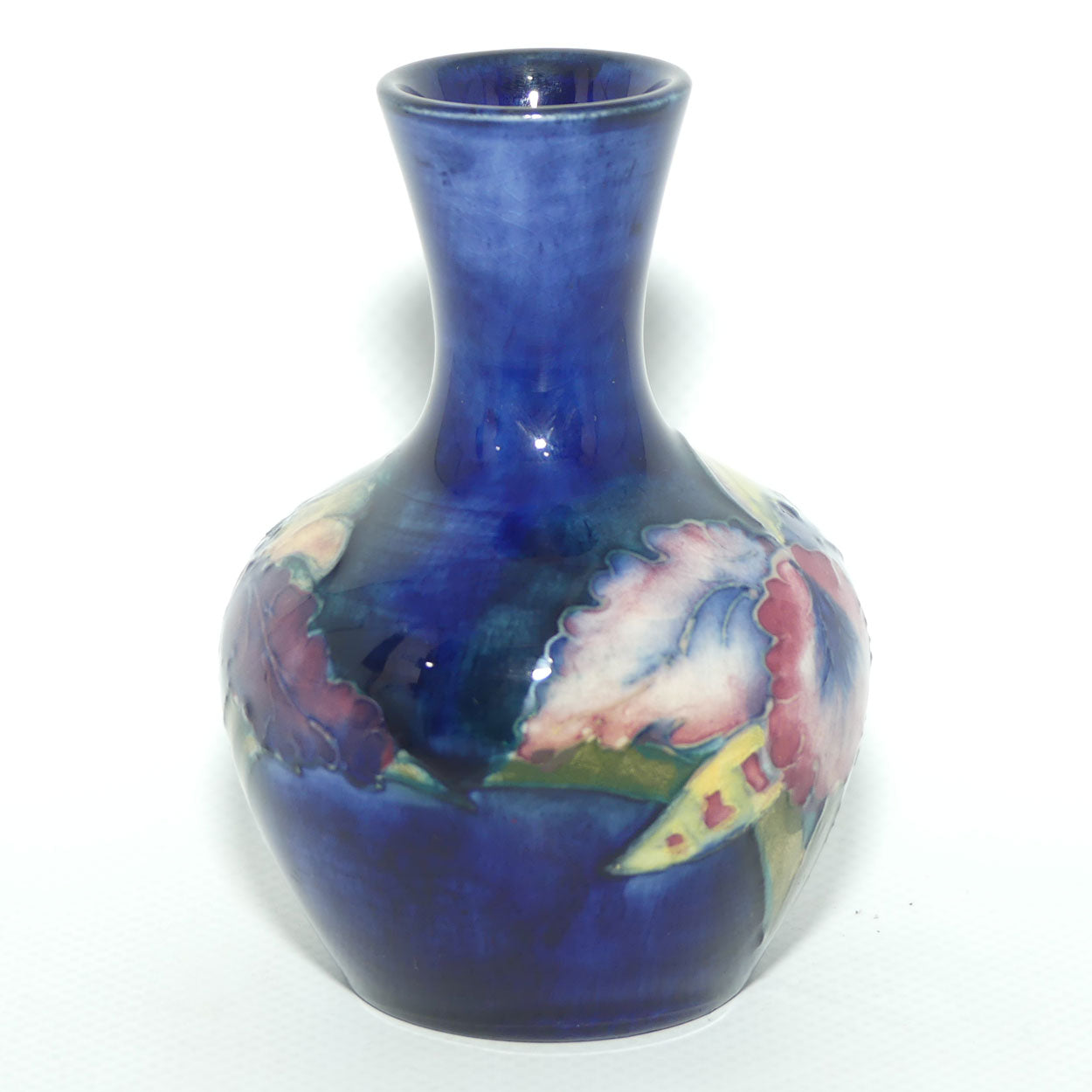 Walter Moorcroft Orchid on Blue Ground narrow neck miniature bud vase