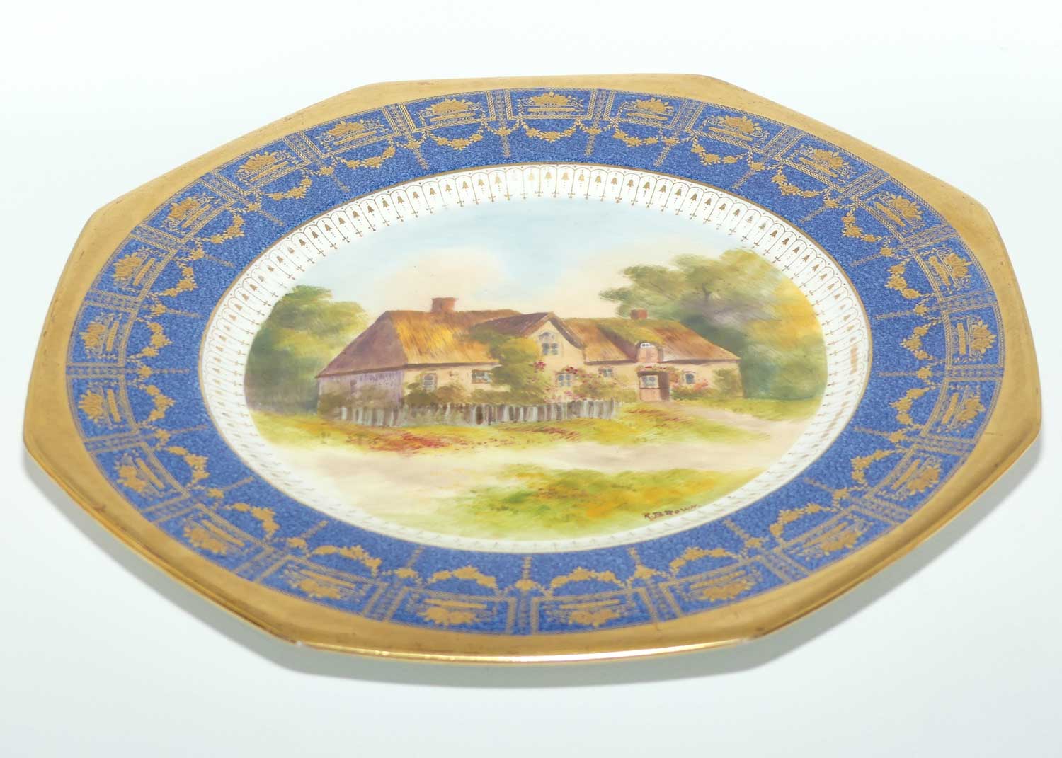 Royal Doulton hand painted and gilt English Thatched Cottage octagonal shape plate | signed R Brown
