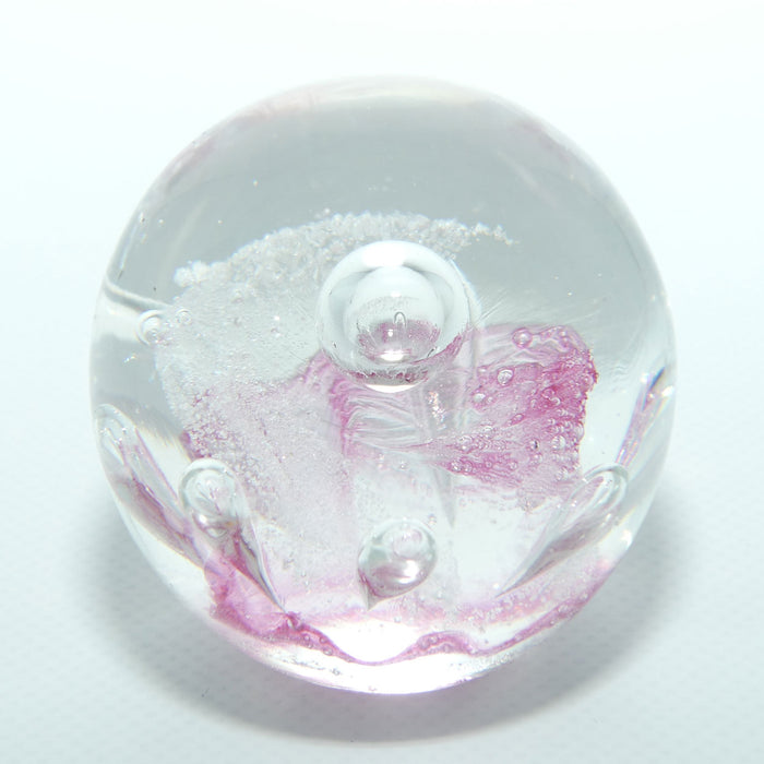 Controlled bubble within Pink Swirl paperweight