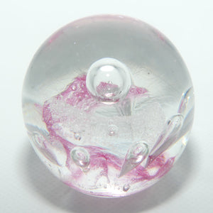 Controlled bubble within Pink Swirl paperweight