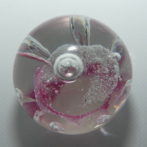 Controlled bubble within Pink Swirl paperweight