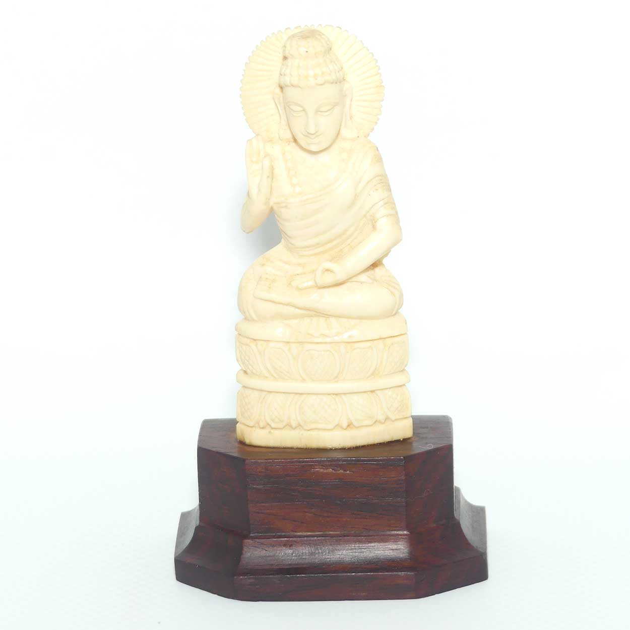 Finely carved Carved Ivory Buddha on Rosewood stand