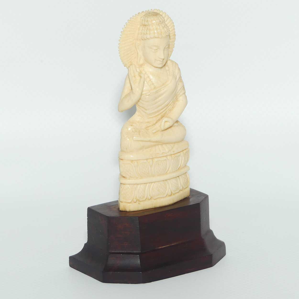 Finely carved Carved Ivory Buddha on Rosewood stand