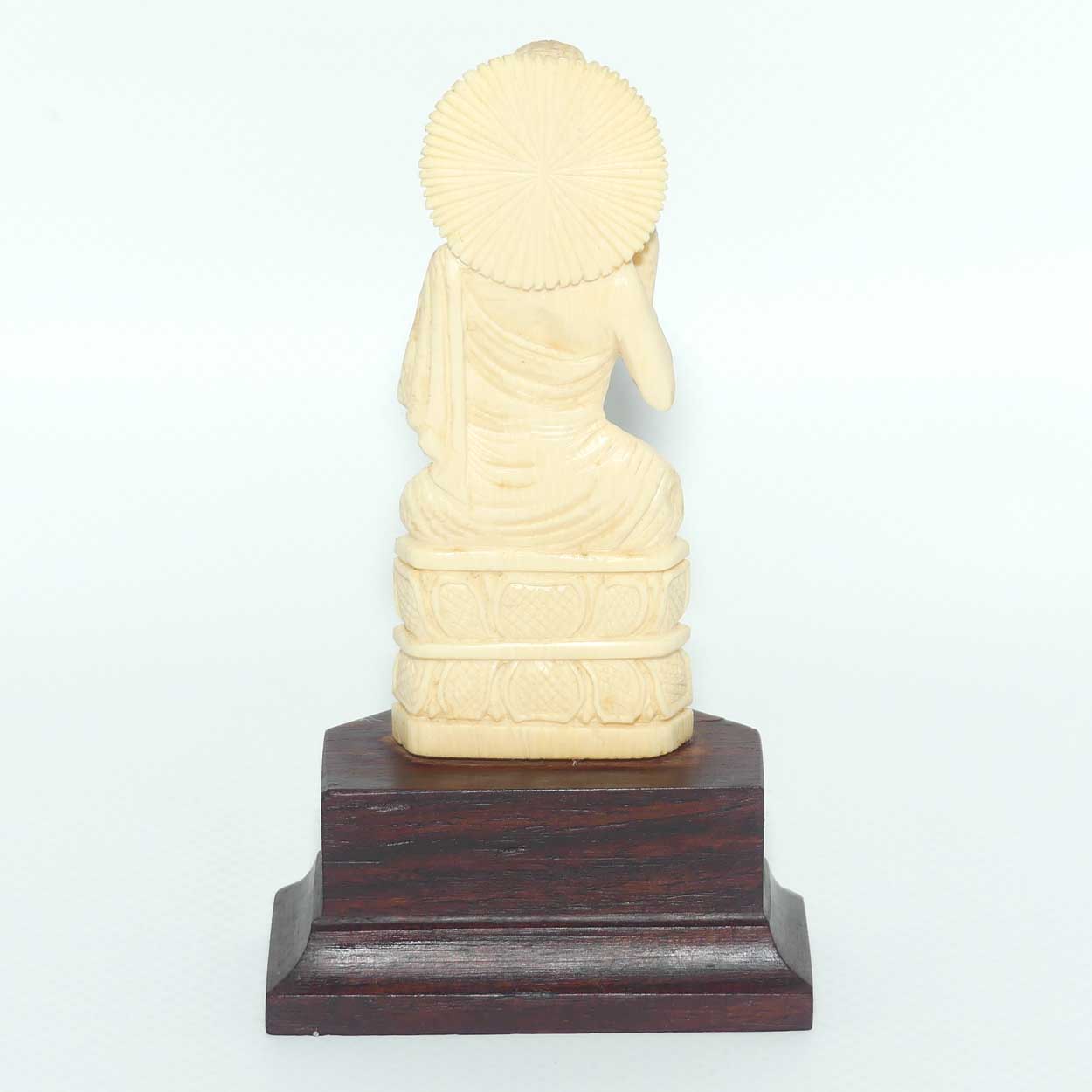 Finely carved Carved Ivory Buddha on Rosewood stand