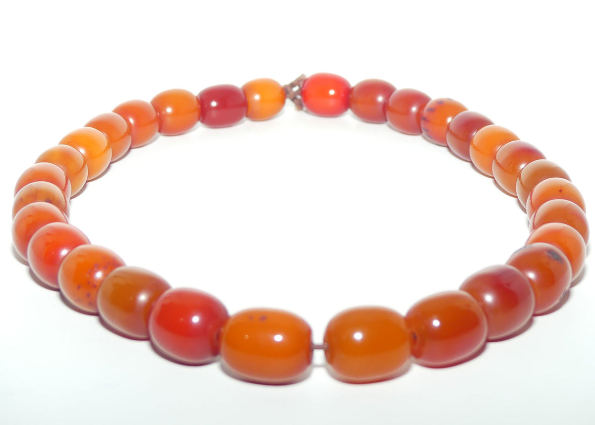 Very Heavy Antique set of Butterscotch Amber beads - strung on cord | 70cm total length