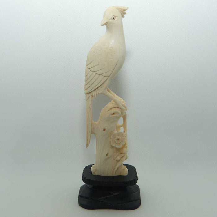 Carved Ivory Cardinal in wooden stand