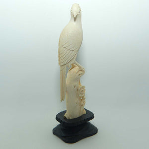 Carved Ivory Cardinal in wooden stand