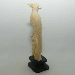 Carved Ivory Cardinal in wooden stand