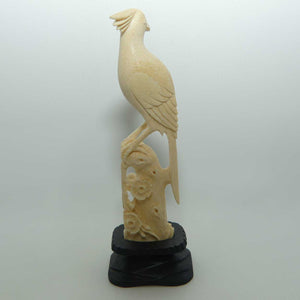 Carved Ivory Cardinal in wooden stand