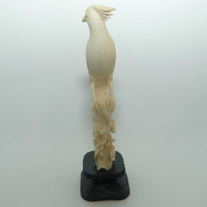 Carved Ivory Cardinal in wooden stand