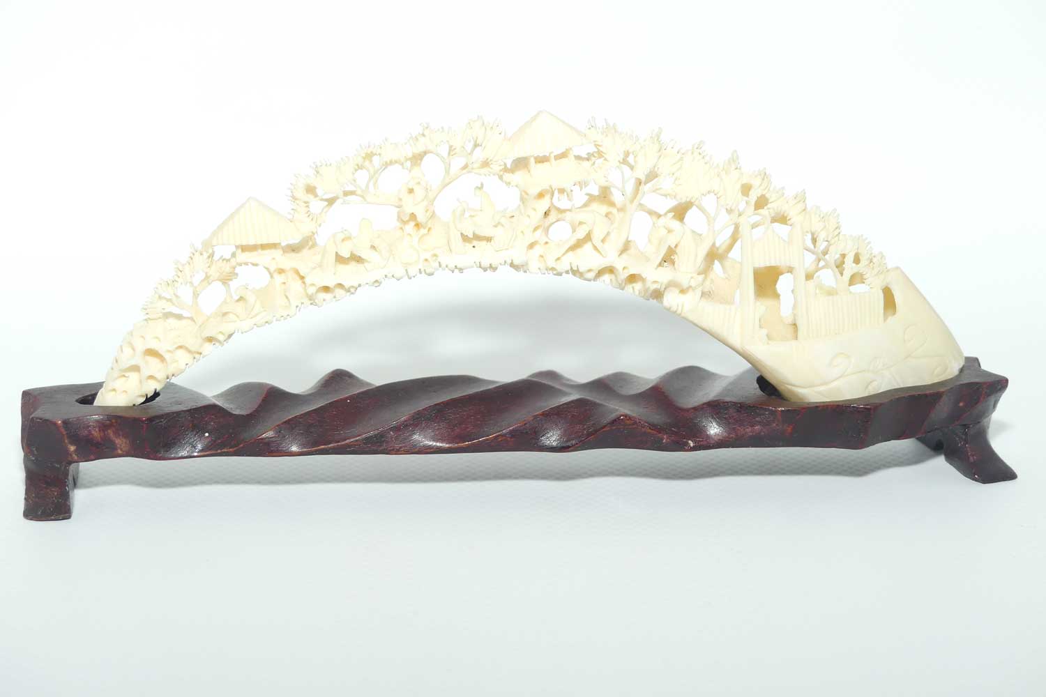 Carved Ivory Tusk depicting Chinese Village on wooden stand | 20cm