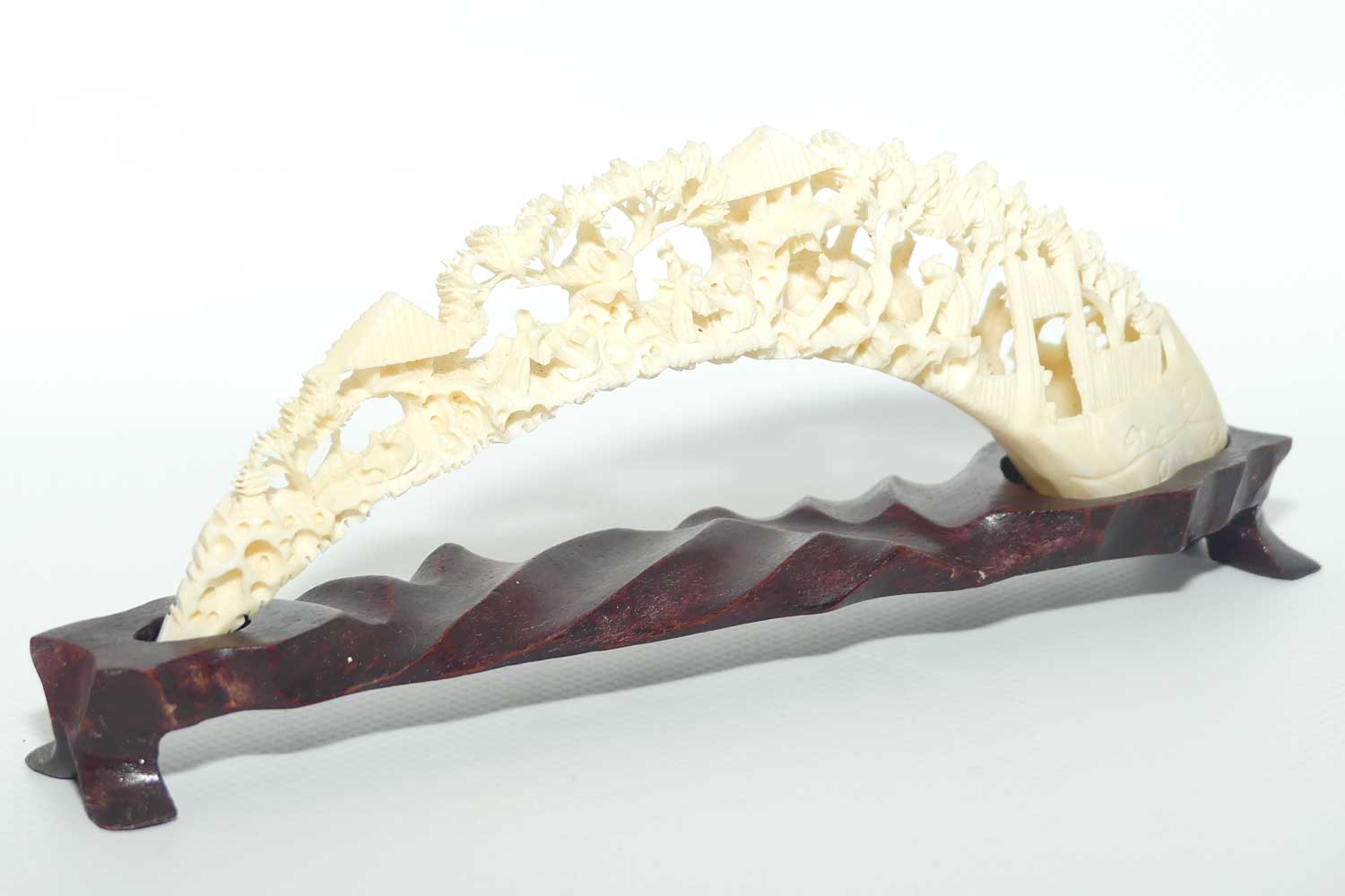Carved Ivory Tusk depicting Chinese Village on wooden stand | 20cm