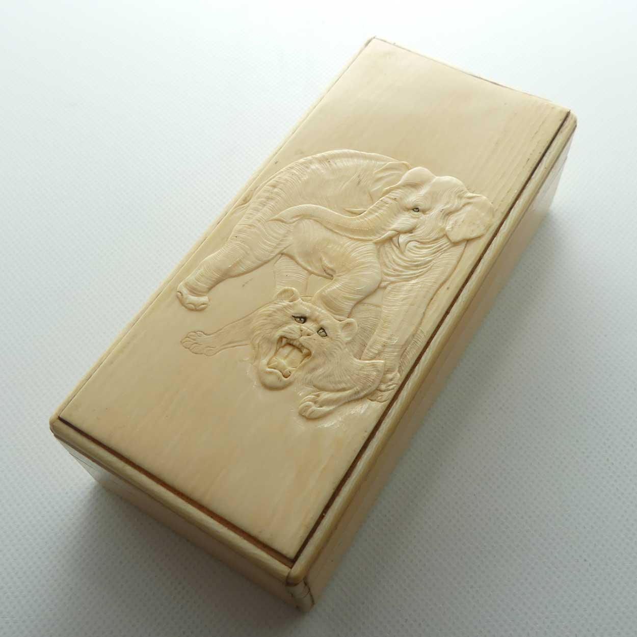 Carved Ivory trinket box depicting Elephant and Tiger