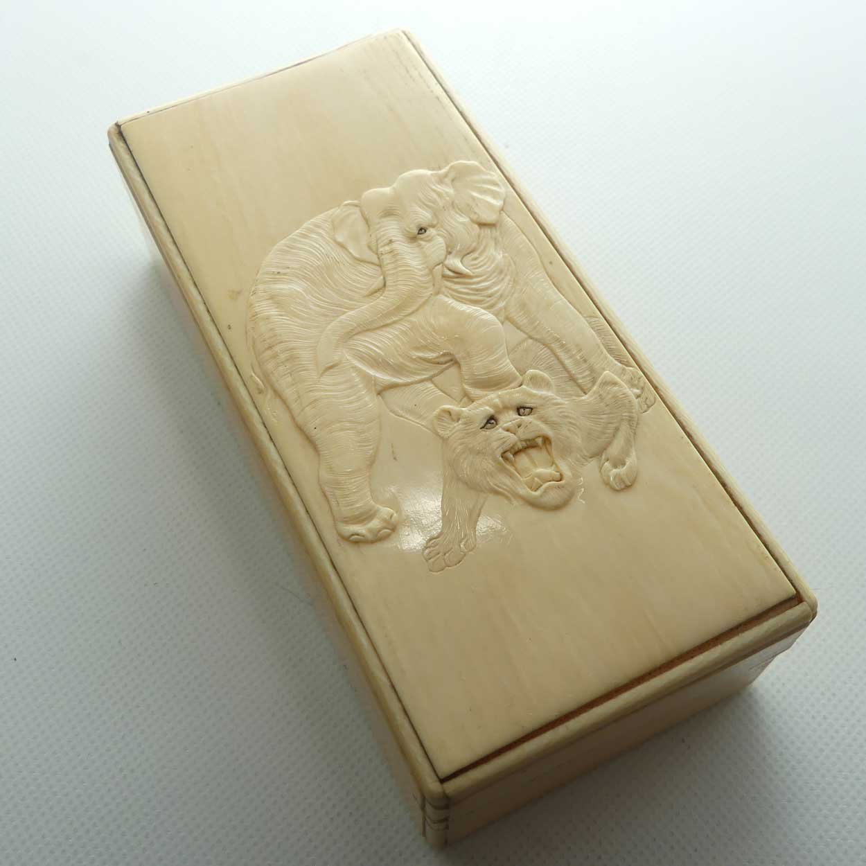 Carved Ivory trinket box depicting Elephant and Tiger