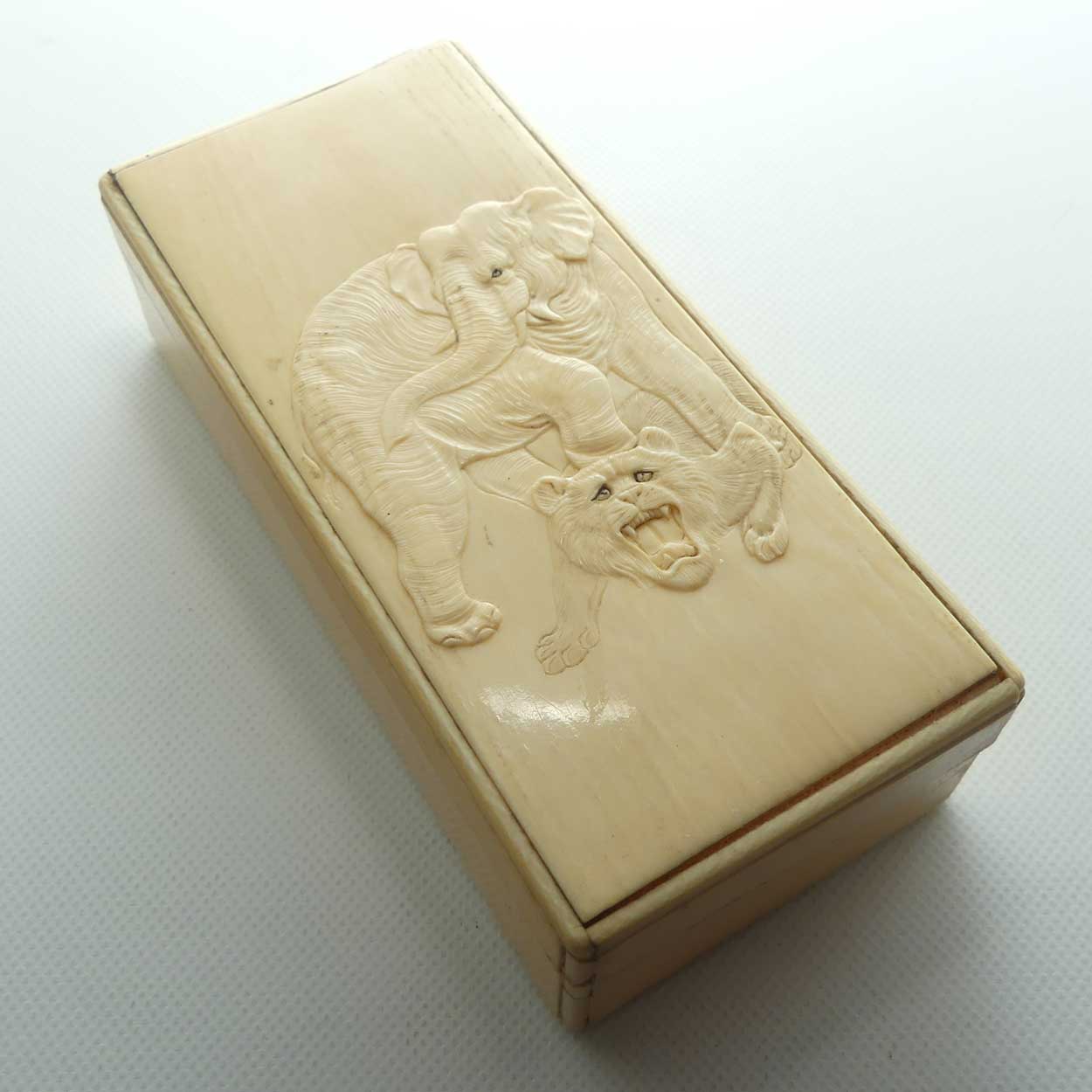 Carved Ivory trinket box depicting Elephant and Tiger