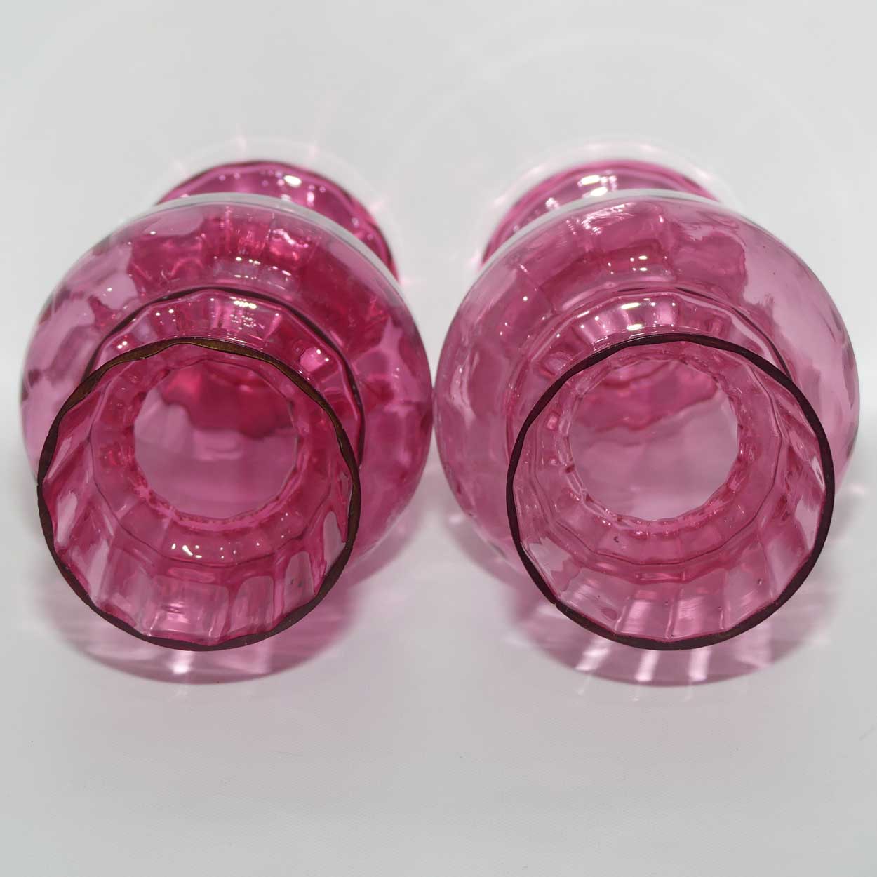 Cranberry Mary Gregory pair of vases depicting a boy with a walking cane and a girl on tip toes