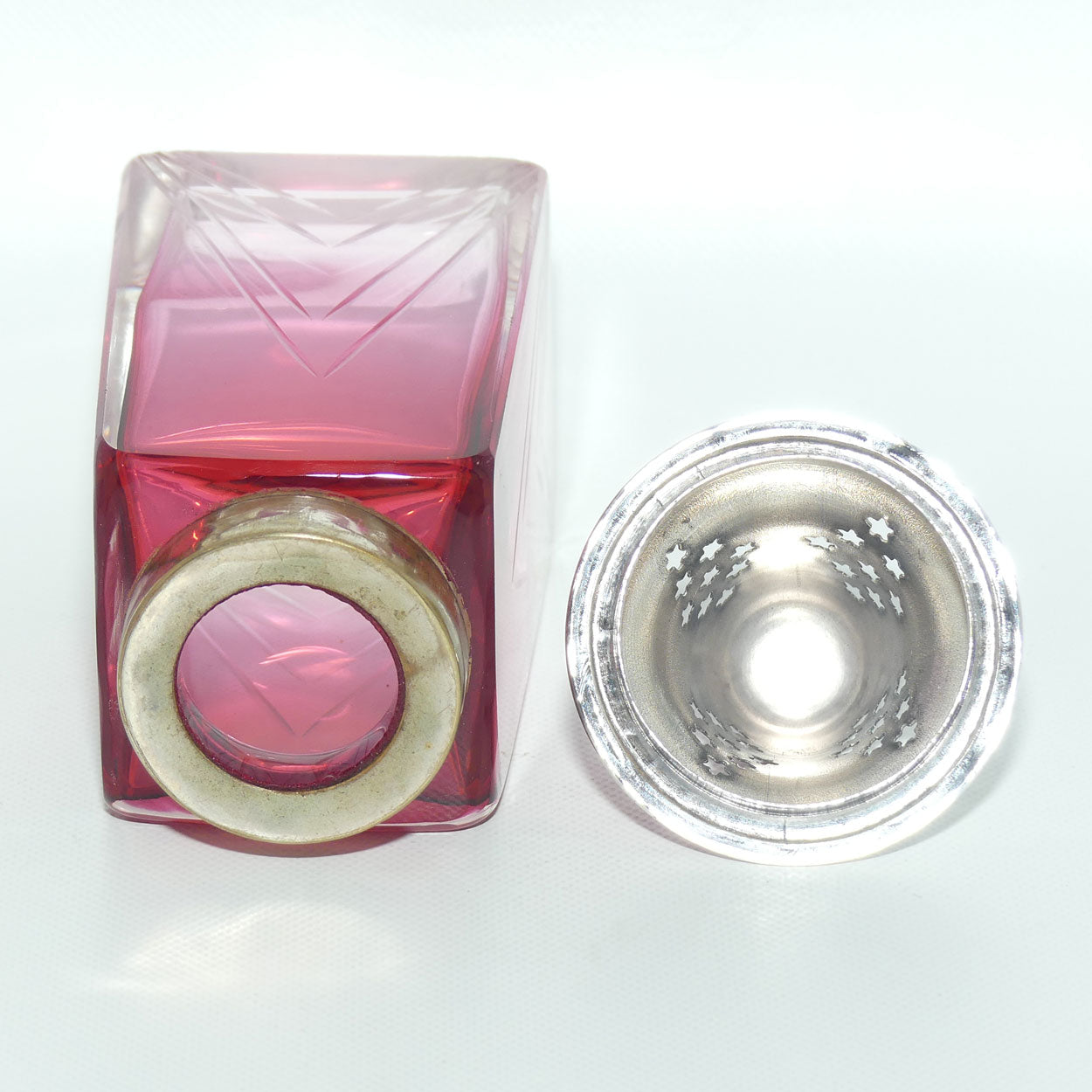 Victorian era Cranberry Glass with facetted design sugar castor | EPNS lid