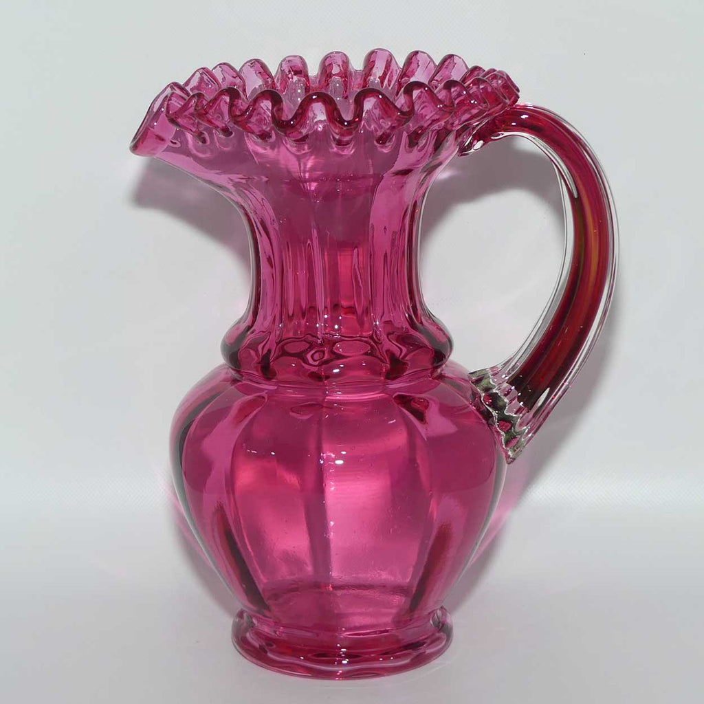 Victorian era Cranberry Glass frilled top jug