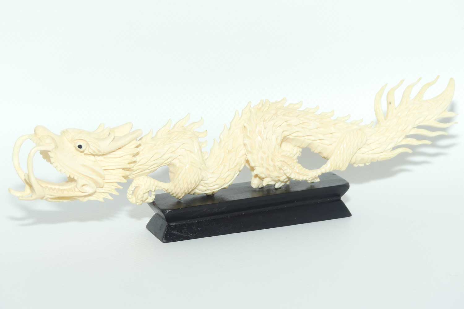 Carved Ivory figure of Dragon on Wooden base | 20cm long