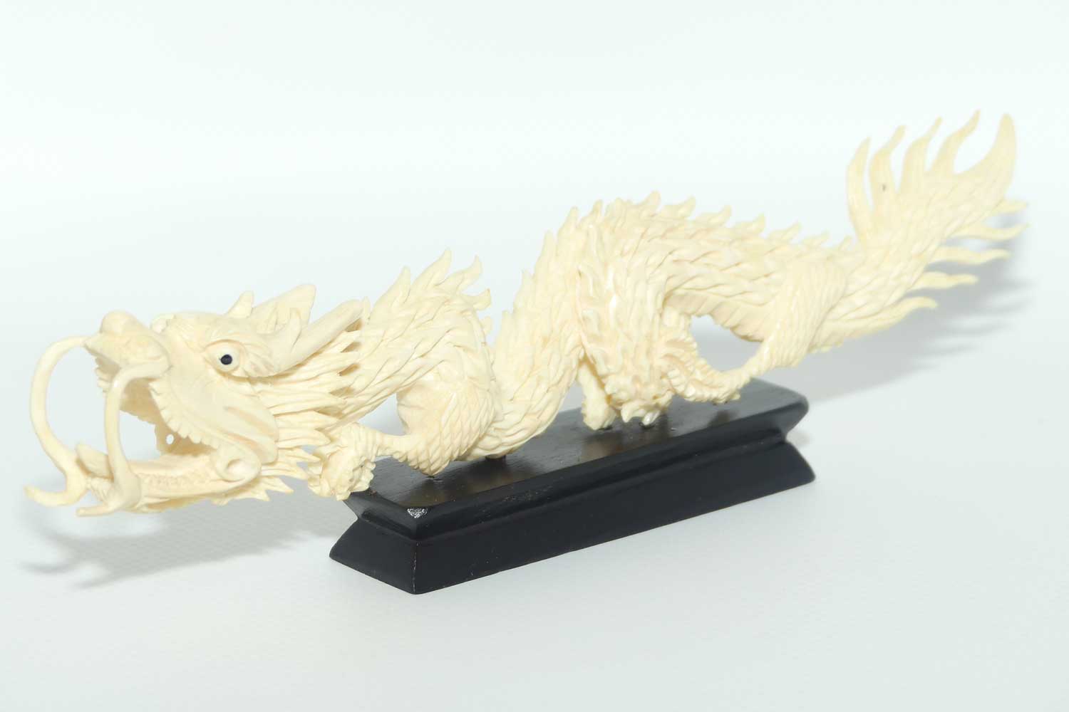 Carved Ivory figure of Dragon on Wooden base | 20cm long