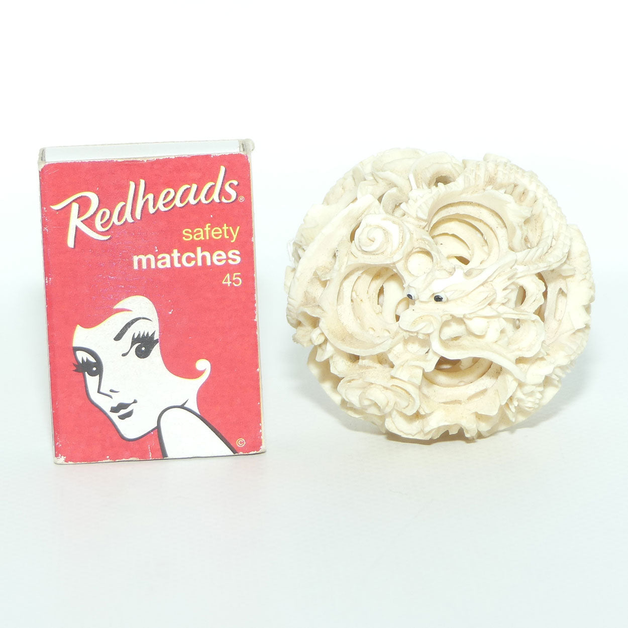Carved Ivory Puzzle Ball on stand | Dragon with Black Eyes | 16.5cm tall