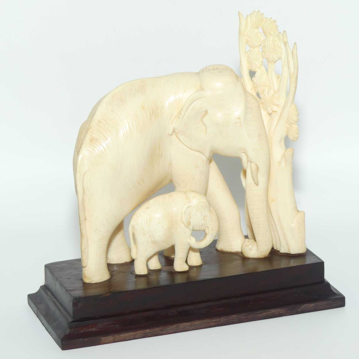 Carved Ivory figure of Mother Elephant and Calf on Rosewood Base