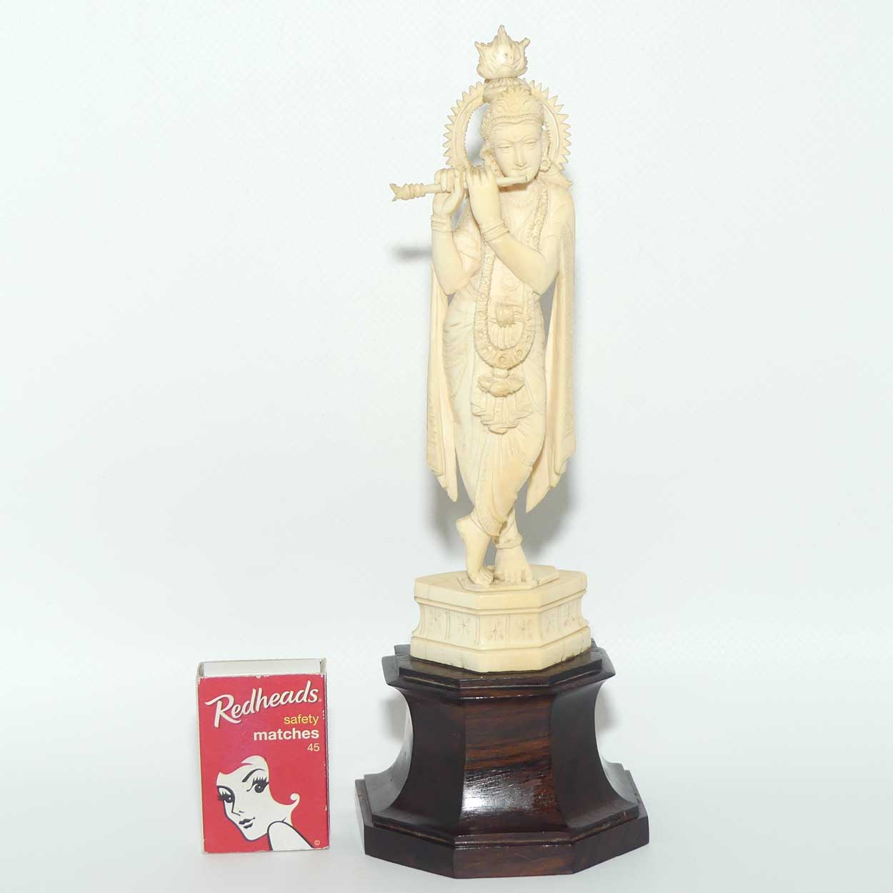 Carved Ivory figure of Hindi Deity Lord Krishna playing a Flute