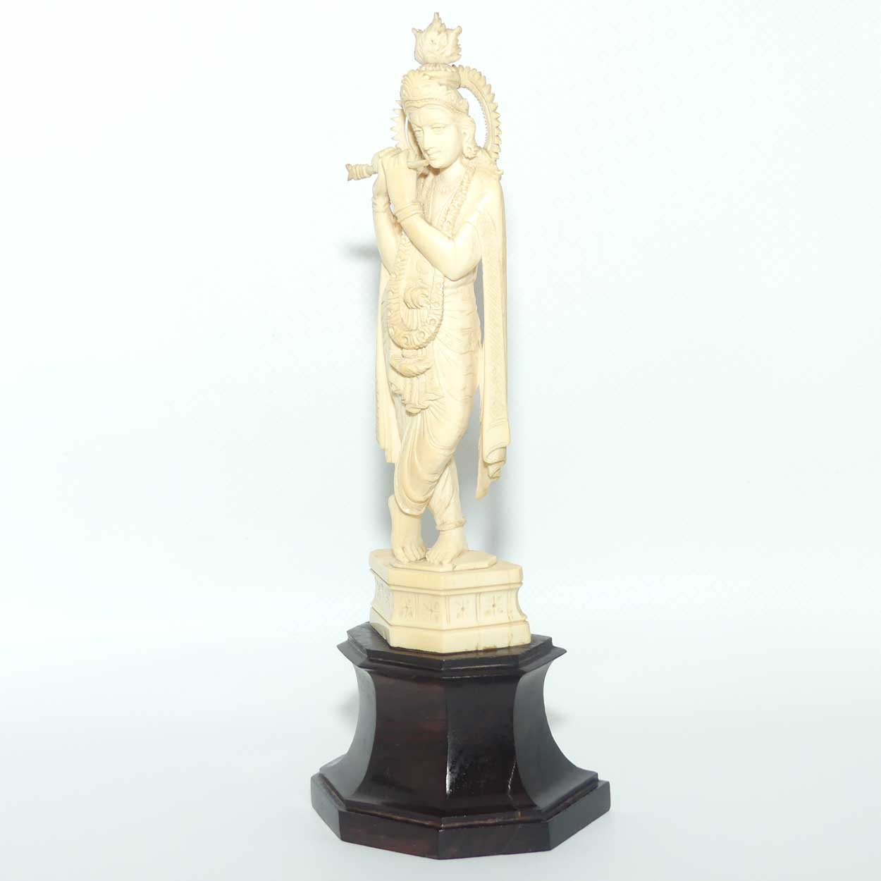 Carved Ivory figure of Hindi Deity Lord Krishna playing a Flute