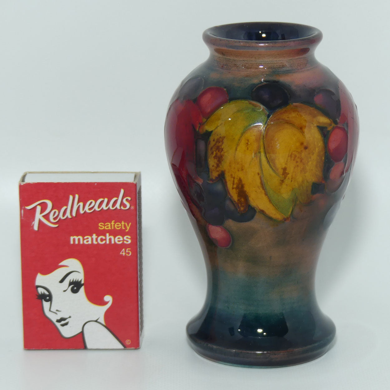 William Moorcroft Flambe Leaves and Fruit miniature vase