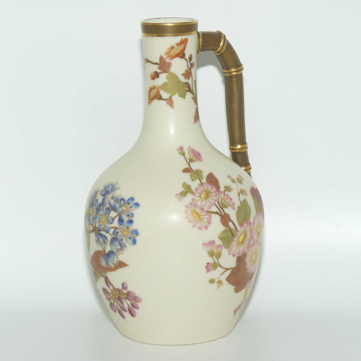 Royal Worcester Blush Ivory and gilt hand painted floral jug with bamboo style handle