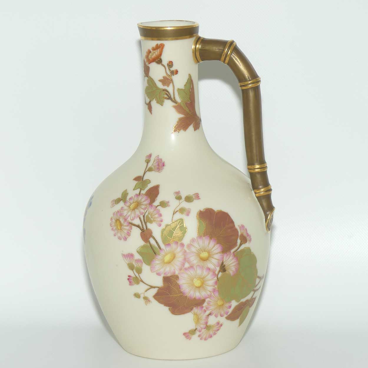 Royal Worcester Blush Ivory and gilt hand painted floral jug with bamboo style handle