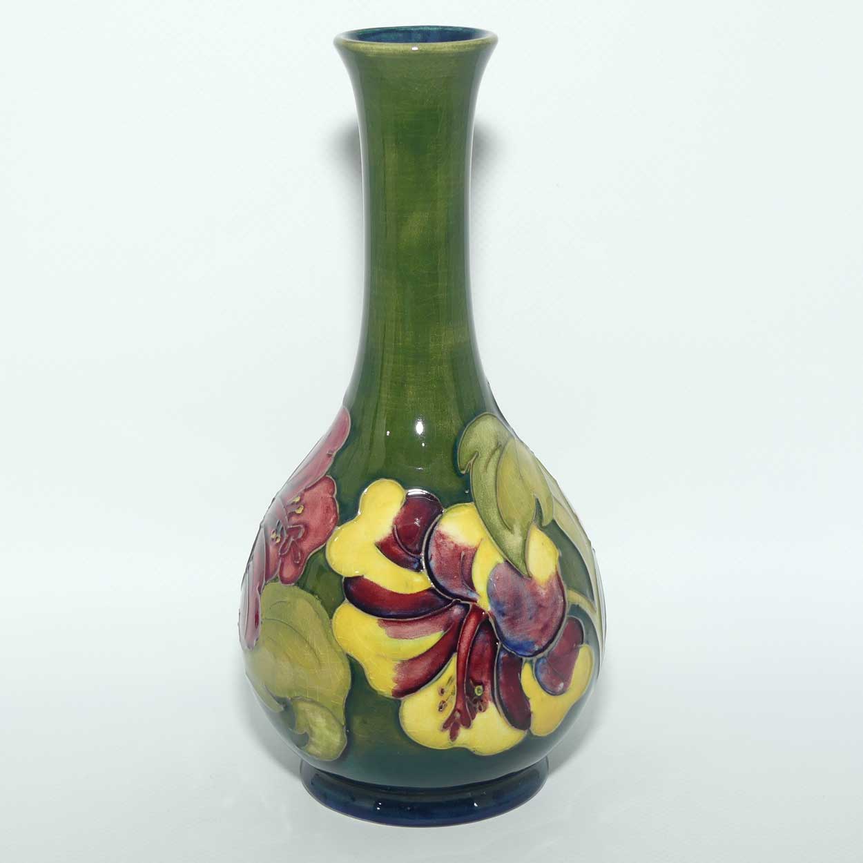 Walter Moorcroft Hibiscus | Olive Green ground slender neck vase | Paper Label intact