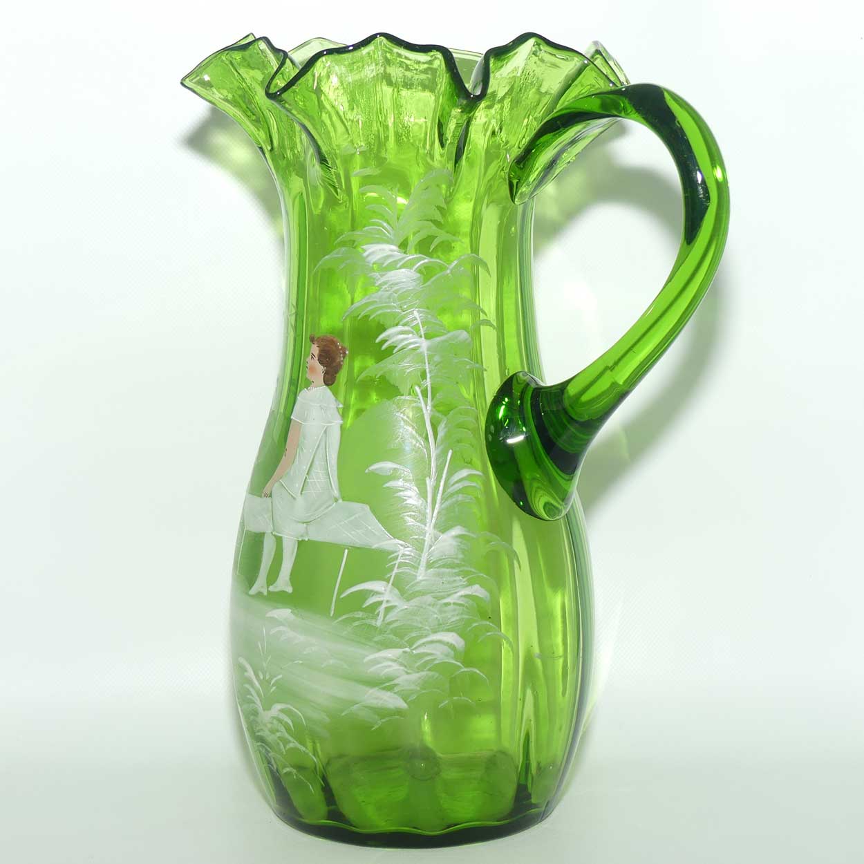 Green Mary Gregory crimped rim glass jug depicting a young girl sitting on bench