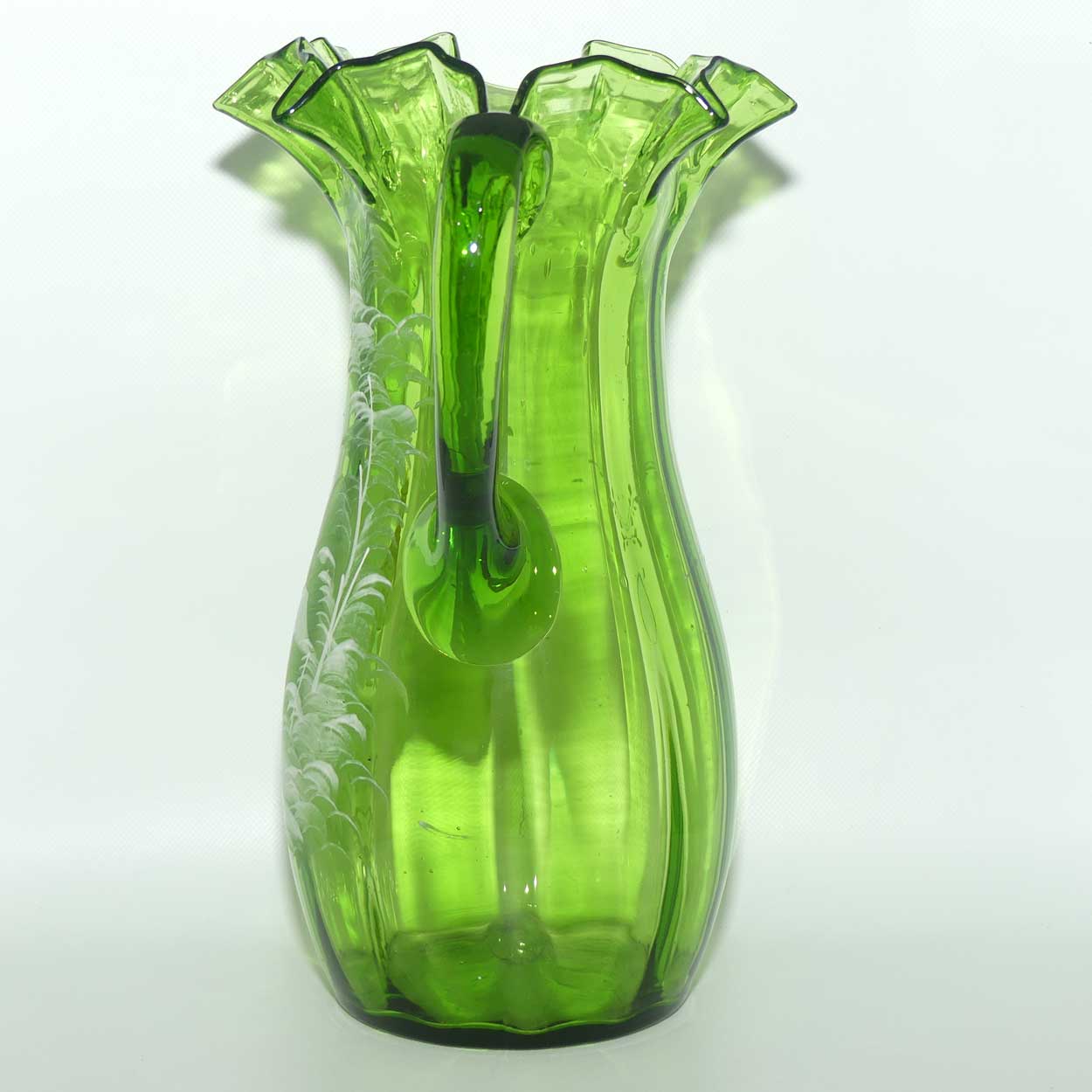 Green Mary Gregory crimped rim glass jug depicting a young girl sitting on bench