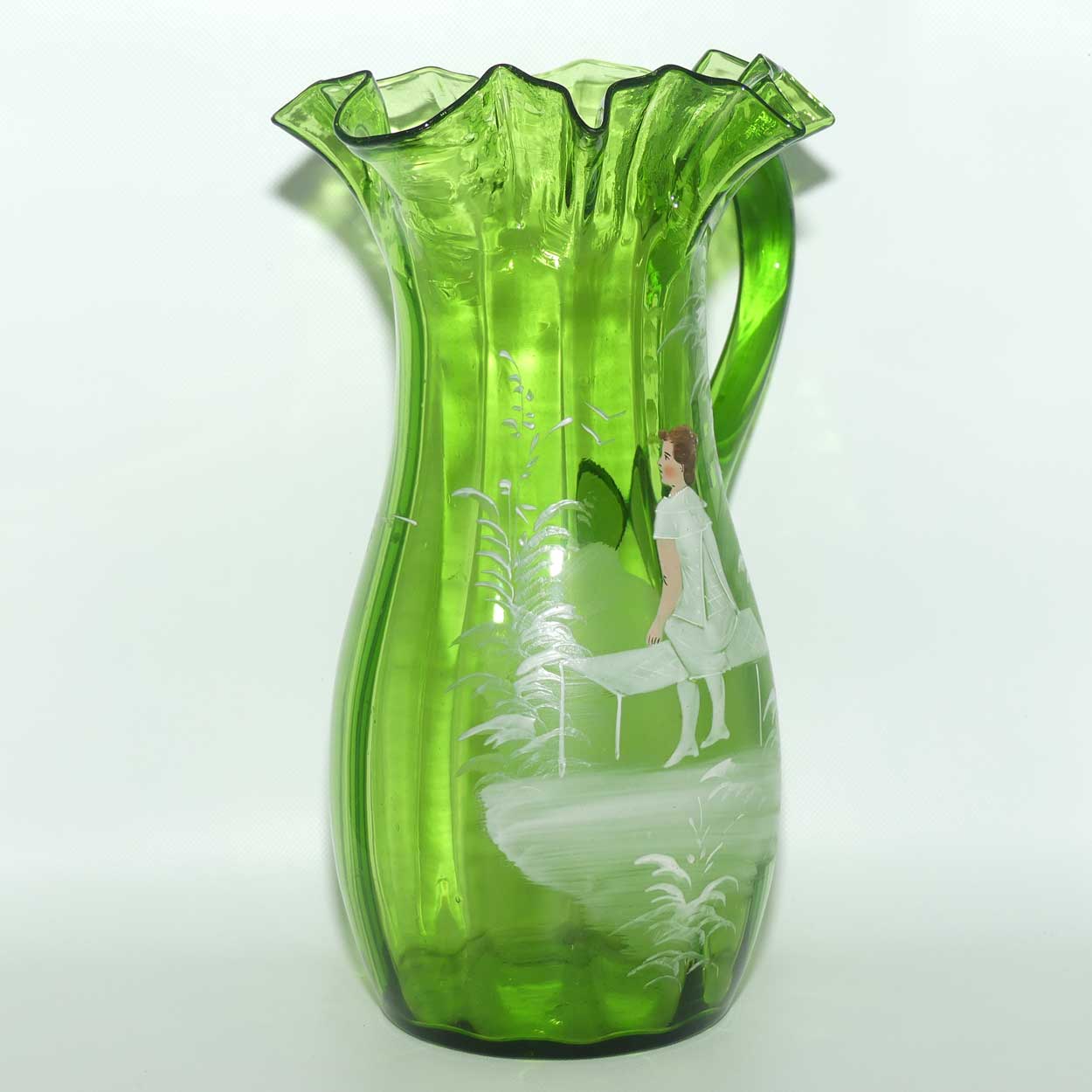Green Mary Gregory crimped rim glass jug depicting a young girl sitting on bench