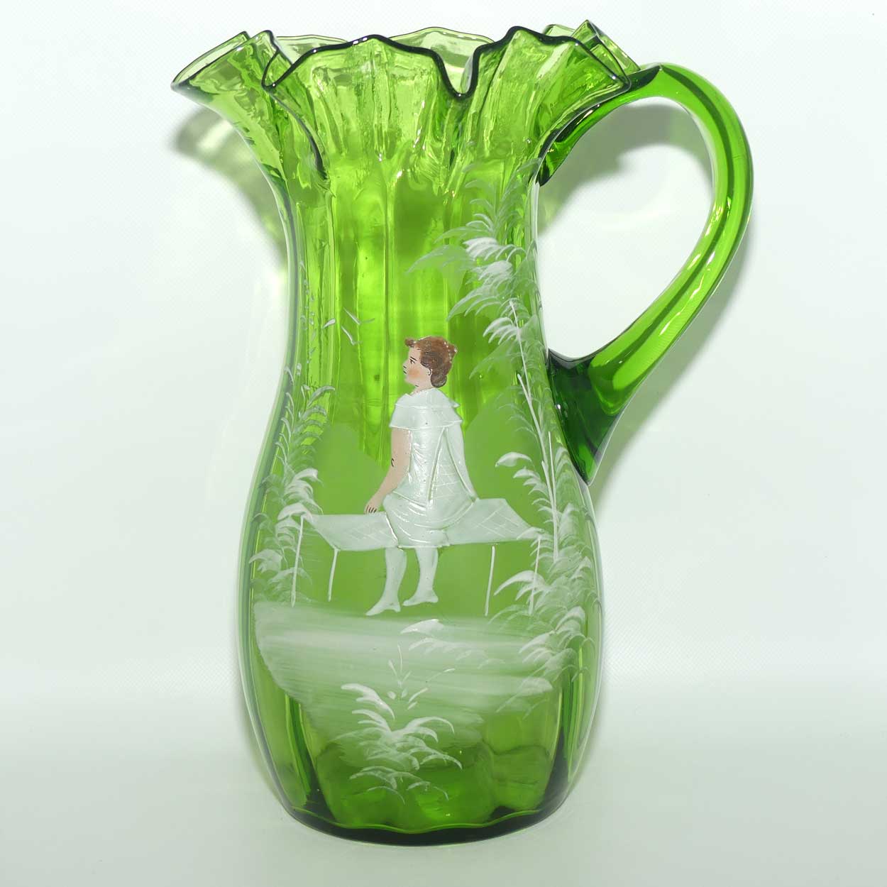 Green Mary Gregory crimped rim glass jug depicting a young girl sitting on bench