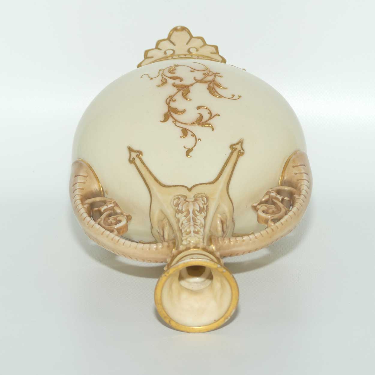 Royal Worcester Blush Ivory heavily gilt handled vase on quad feet