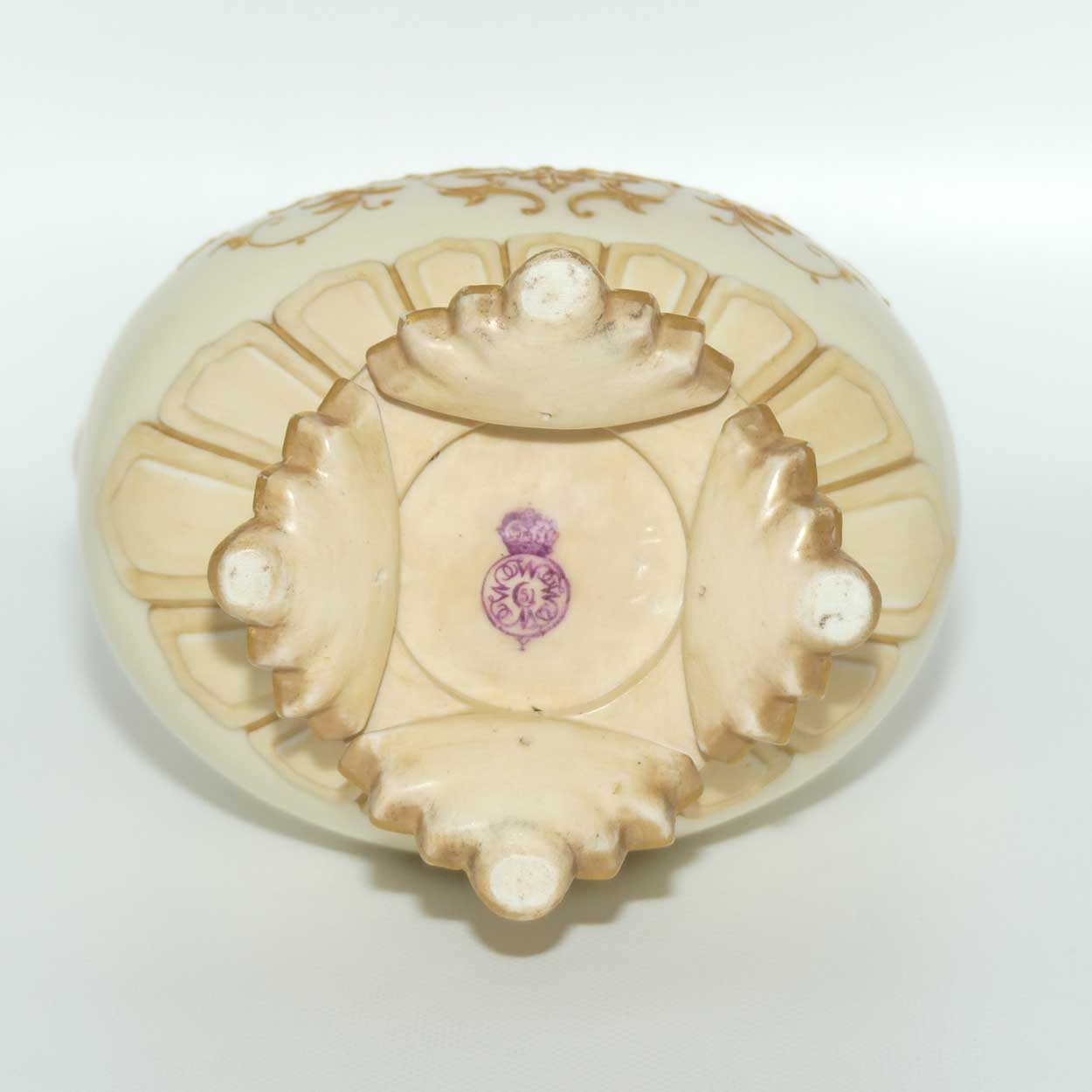 Royal Worcester Blush Ivory heavily gilt handled vase on quad feet