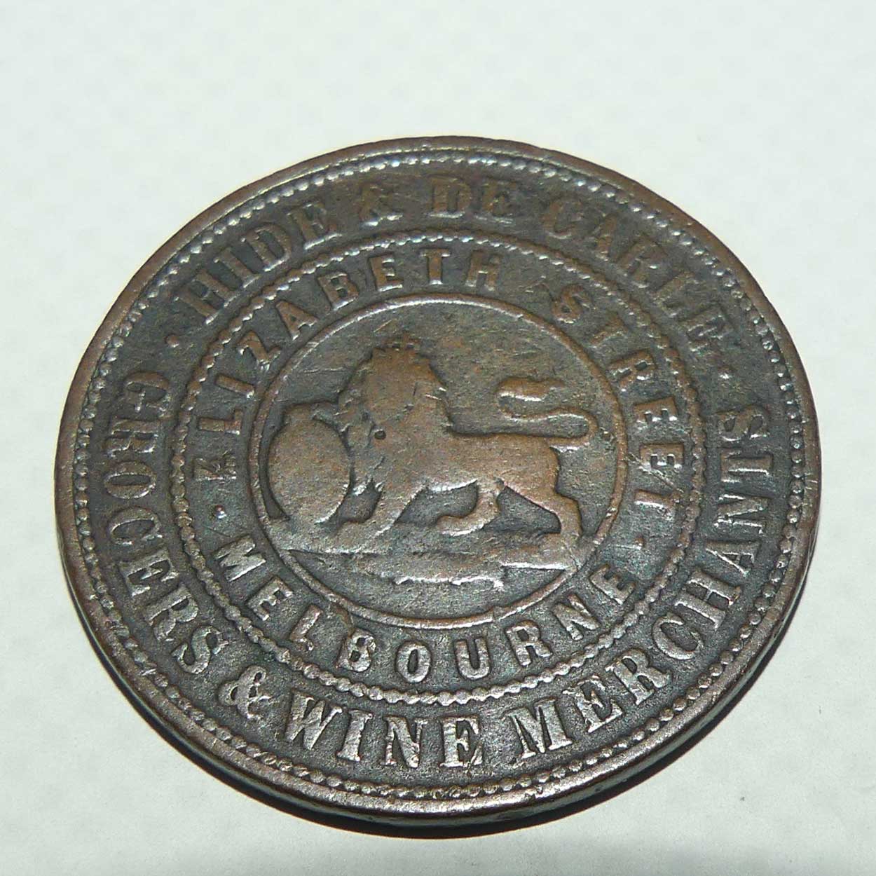 Token | 1 Penny | Hide & De Carle, Grocers & Wine Merchants, Melbourne, Victoria 1857